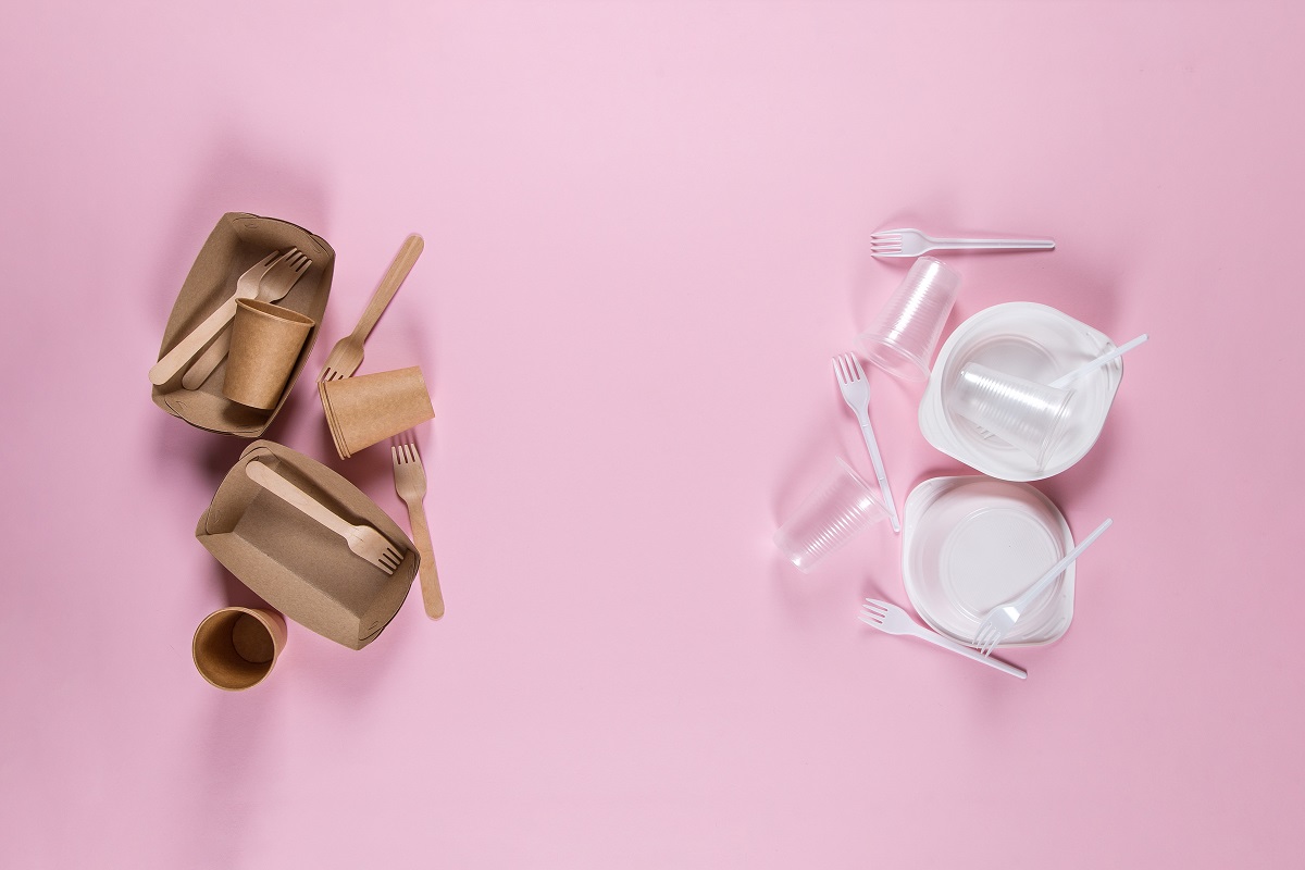 Plastic And Paper Utensils On Pink Background. Choosing Eco Friendly Utensils, Fighting Eco Disaster.