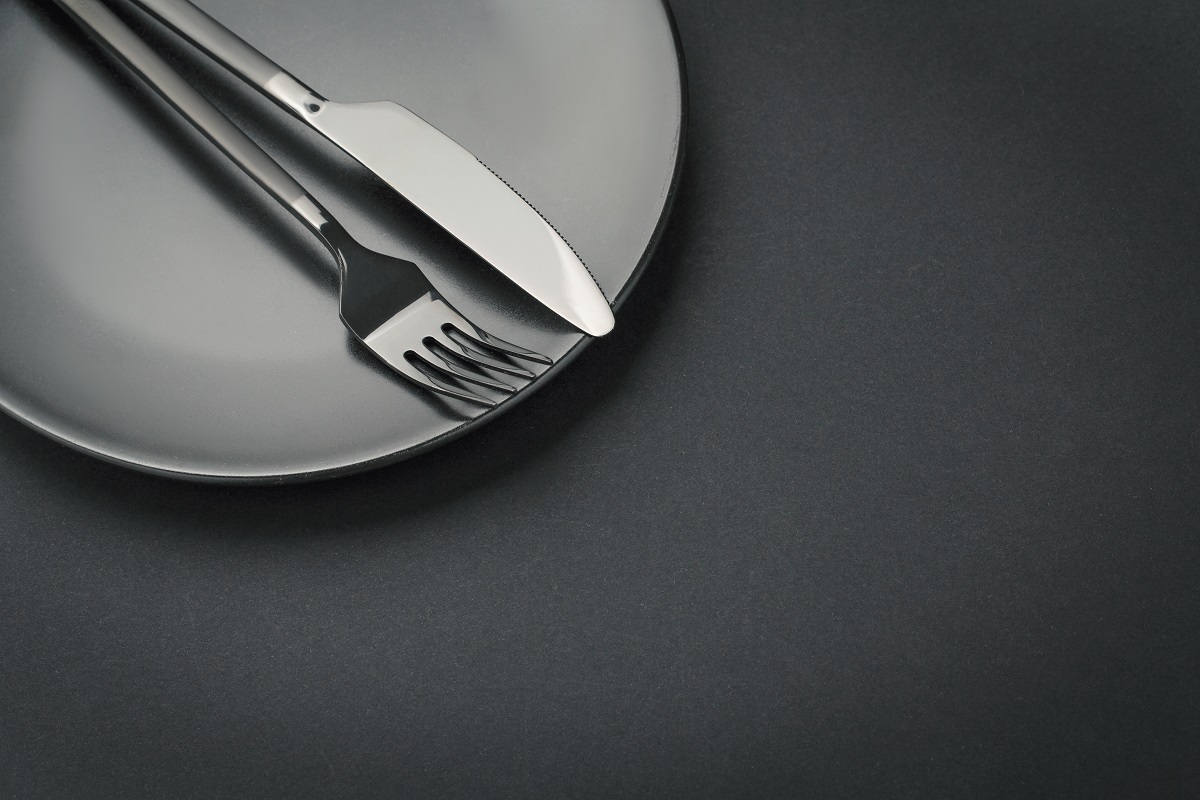 Gold Cutlery Set On Black Background