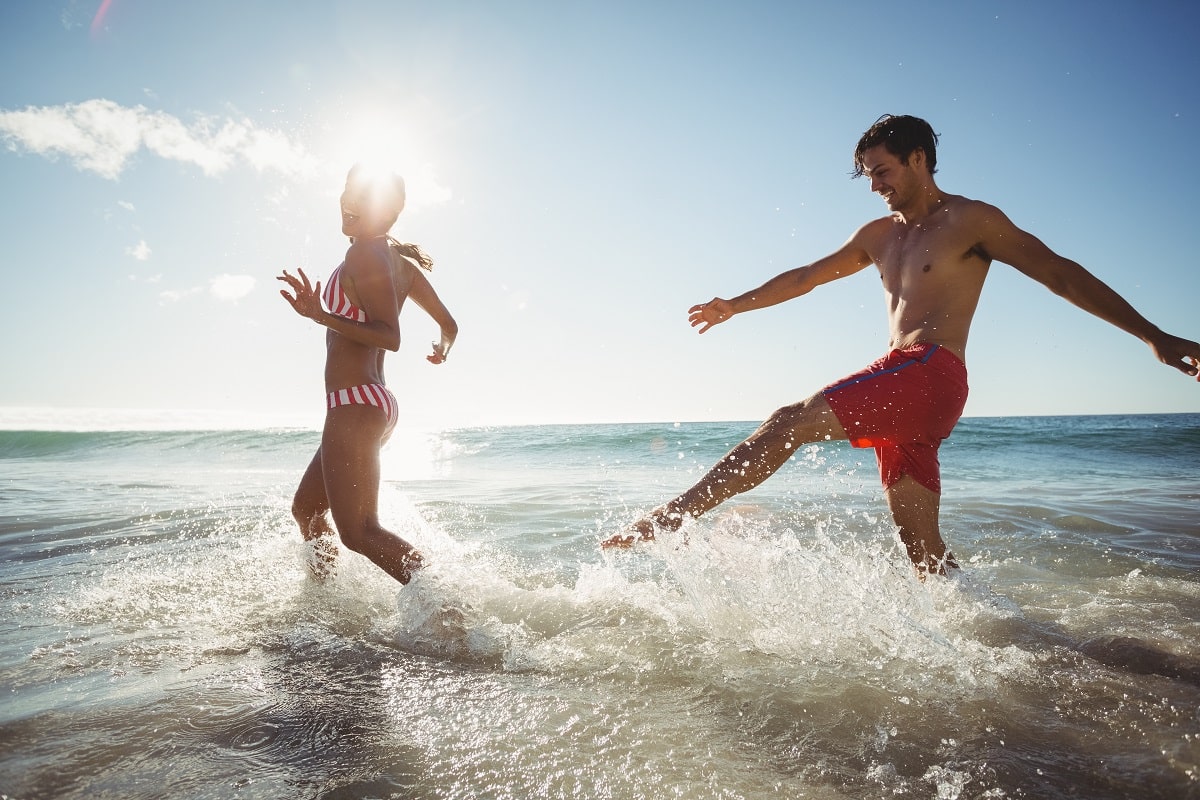 Couple Playing In Water